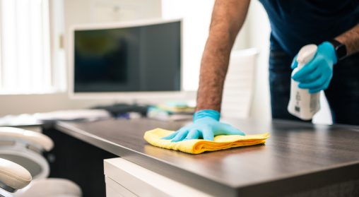 disinfecting office to keep office clean